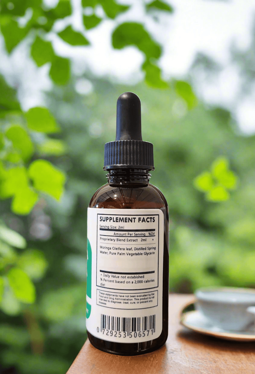 Herbal Island Moringa Oleifera tincture in a clear liquid dropper bottle with label, ready for herbal supplement use.