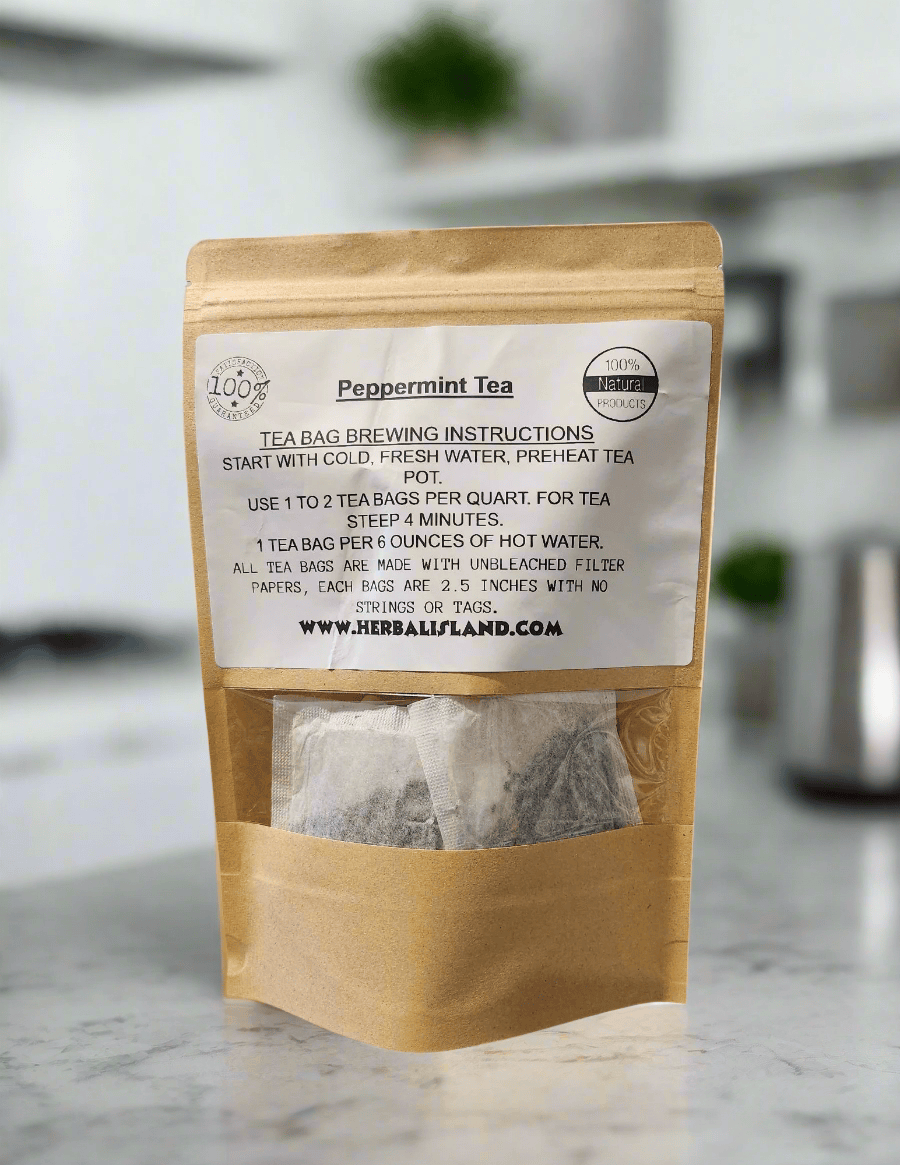 Herbal Island peppermint tea bags stacked in a box, showing fresh, aromatic peppermint leaves on the packaging.