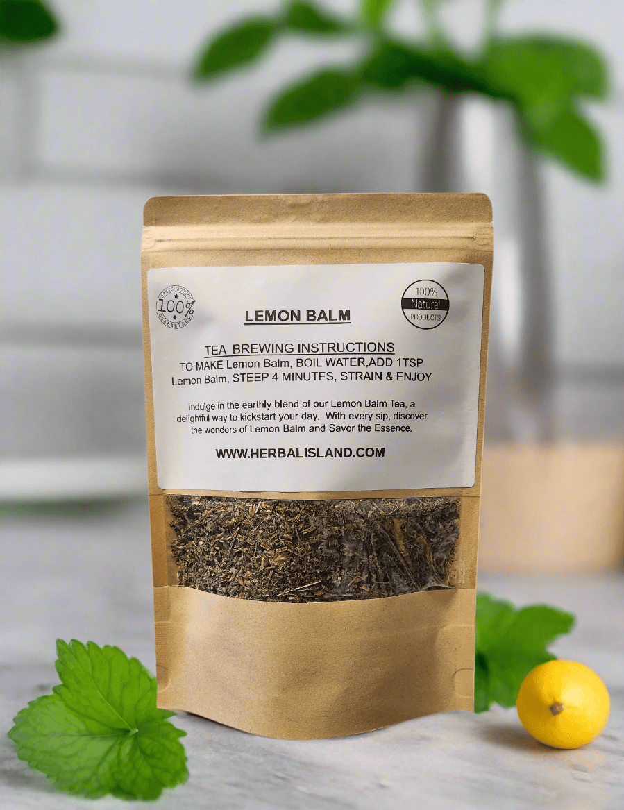 Herbal Island Lemon Balm Tea in a clear glass cup with fresh lemon slices and mint leaves on a wooden table.