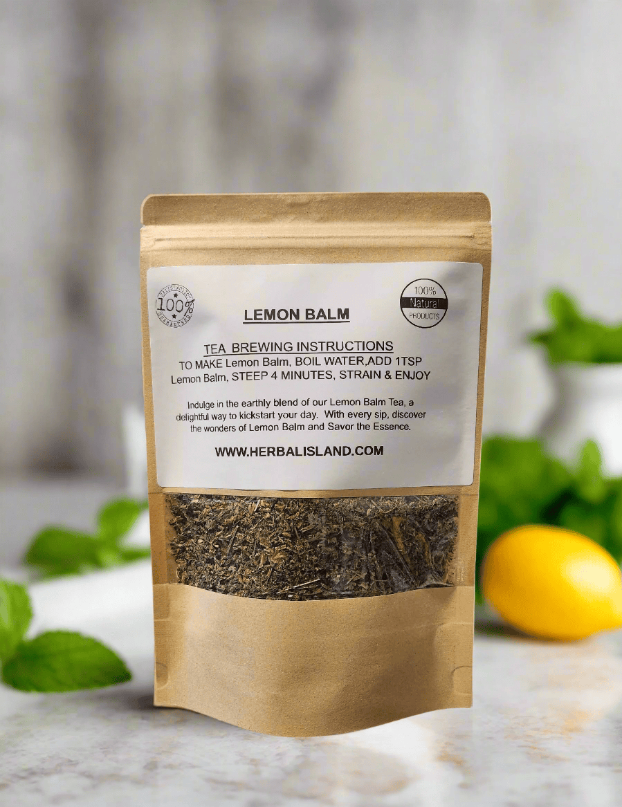 Herbal Island Lemon Balm Tea in a glass mug with lemon slices and fresh lemon balm leaves on a wooden table.