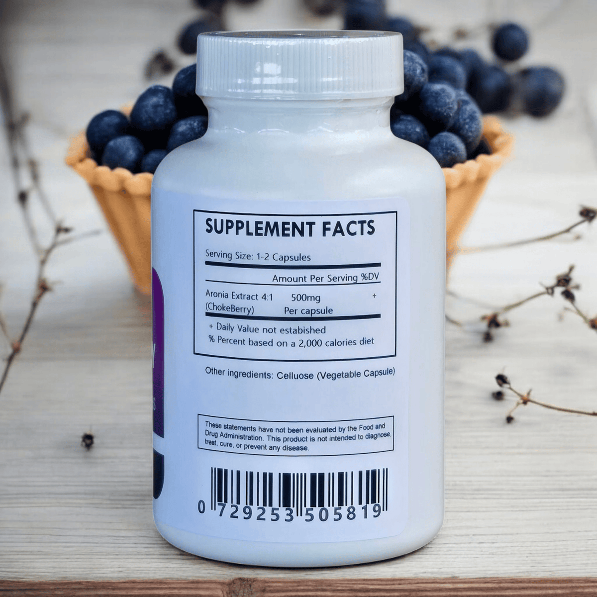 Herbal Island Aronia Extract 4:1 capsules, dietary supplement in soft gel form with dark purple liquid filling.
