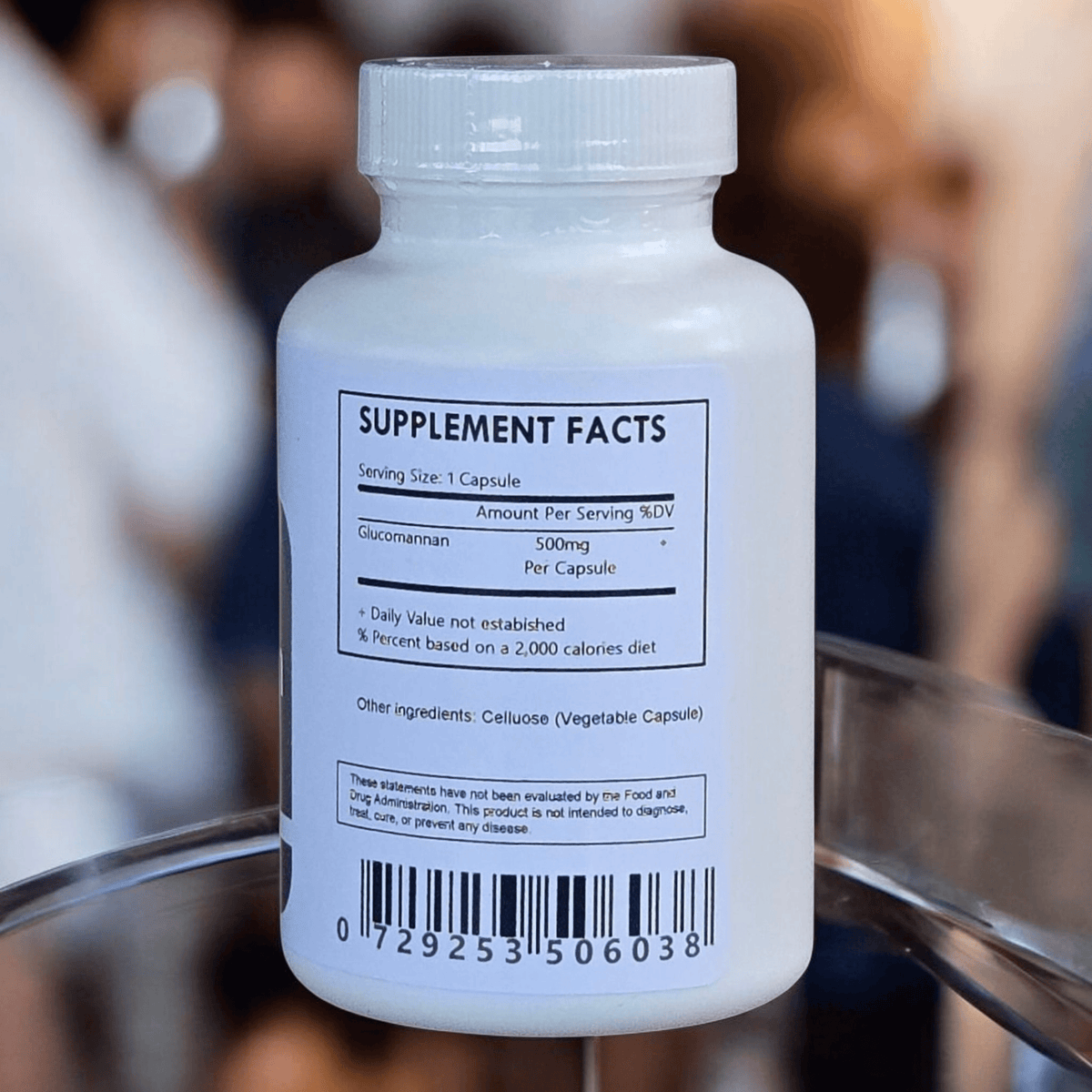 Herbal Island glucomannan konjac capsules in a clear container, showing the soft gelatin capsules filled with konjac root extract.